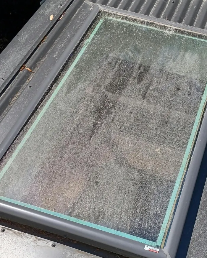 Roof skylight covered in grime and water spots