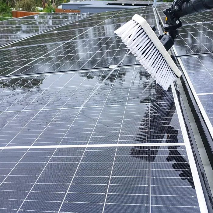 Pure water brush cleaning a solar panel