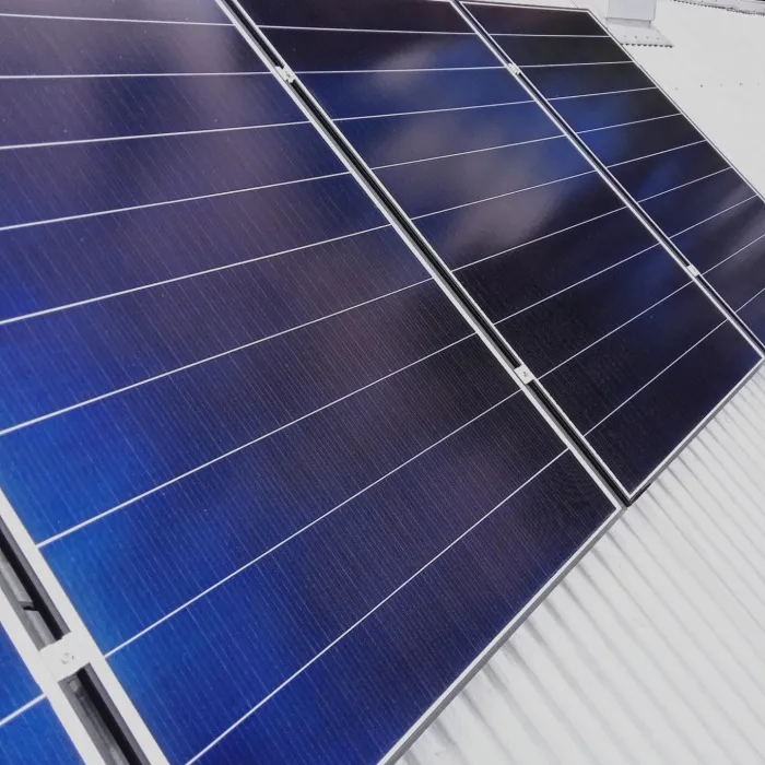 Clean solar panels on a light grey roof